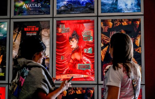 Fans take pictures in the lobby as they attend "Taylor Swift: The Official Release Party of a Showgirl" at AMC Montgomery 16 movie theater in Bethesda