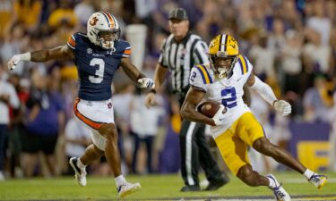 Former LSU wide receiver Lacy runs after a catch against Auburn in October 2023.