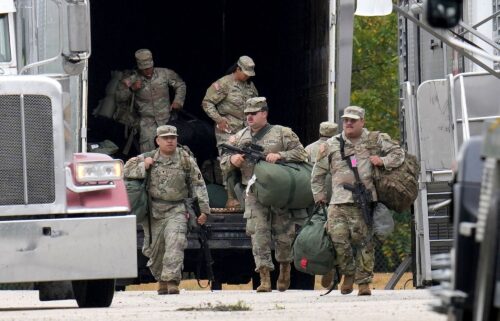 Military personnel in uniforms with the Texas National Guard patch are seen at the US Army Reserve Center in Elwood