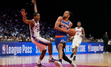 British New York Knicks forward Tosan Evbuomwan drives to the hoop during a preseason game against the Philadelphia 76ers in Abu Dhabi.