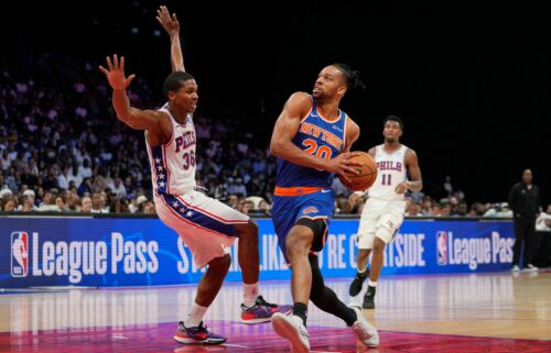 British New York Knicks forward Tosan Evbuomwan drives to the hoop during a preseason game against the Philadelphia 76ers in Abu Dhabi.