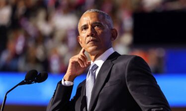 Former President Barack Obama gestures as he speaks at the Democratic National Convention in Chicago on August 20