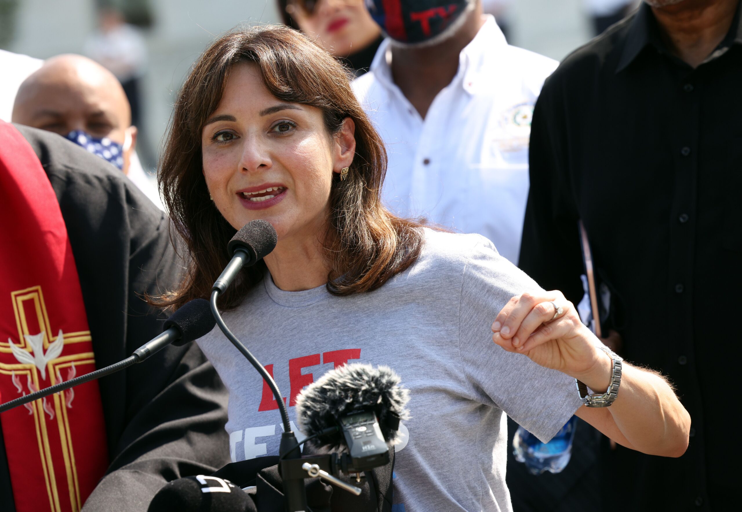 <i>Kevin Dietsch/Getty Images via CNN Newsource</i><br/>Texas State Rep. Gina Hinojosa (D-District 49) speaks alongside fellow representatives and religious leaders at the US Supreme Court on August 12