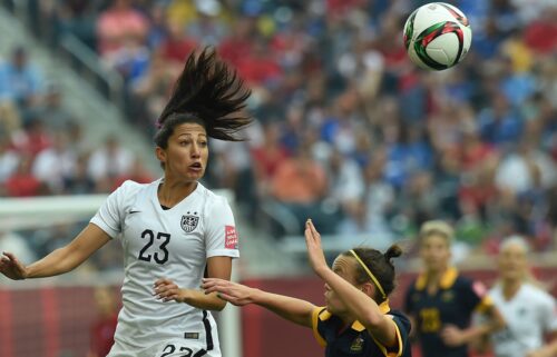 Christen Press heads the ball during a women's World Cup match against Australia in 2021.