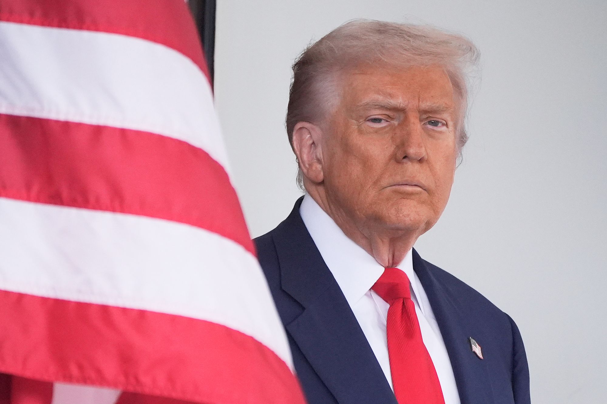 <i>Mark Schiefelbein/AP via CNN Newsource</i><br/>President Donald Trump waits to greet Argentina's President Javier Milei