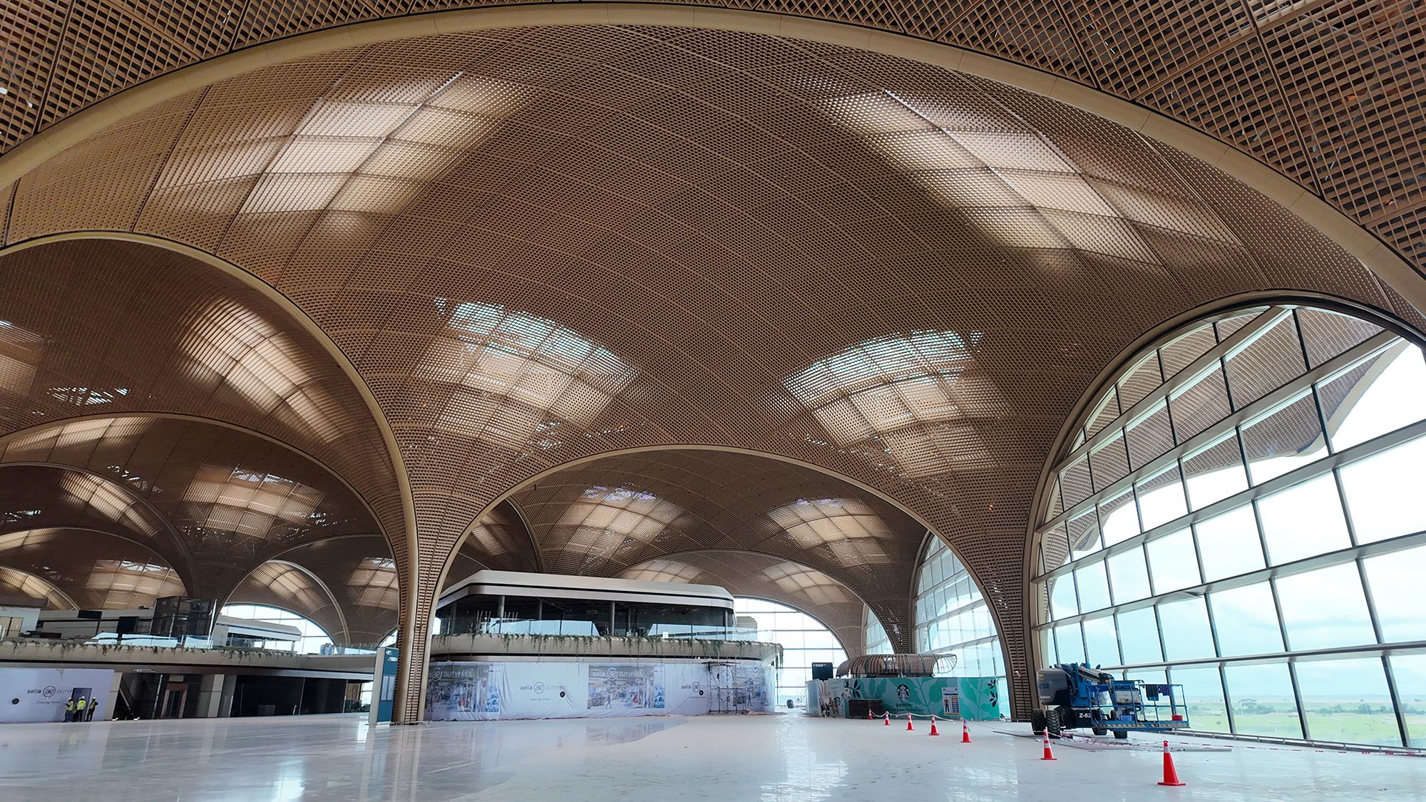 Local trees were planted in baggage claim as a way to acclimate visitors to Cambodia's climate.