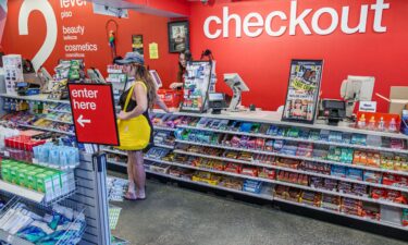 A person makes purchases at a CVS in Miami Beach