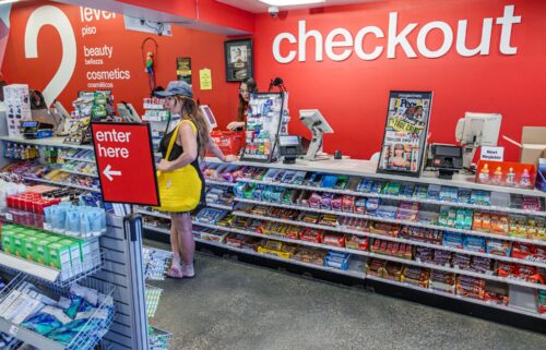 A person makes purchases at a CVS in Miami Beach