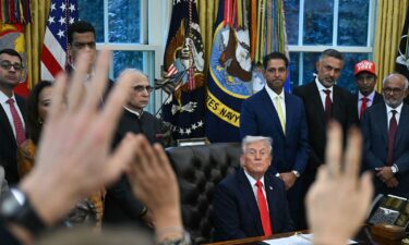 President Donald Trump takes questions from reporters in the Oval Office on October 21.