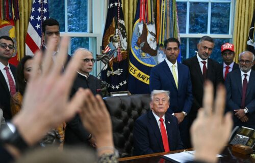President Donald Trump takes questions from reporters in the Oval Office on October 21.
