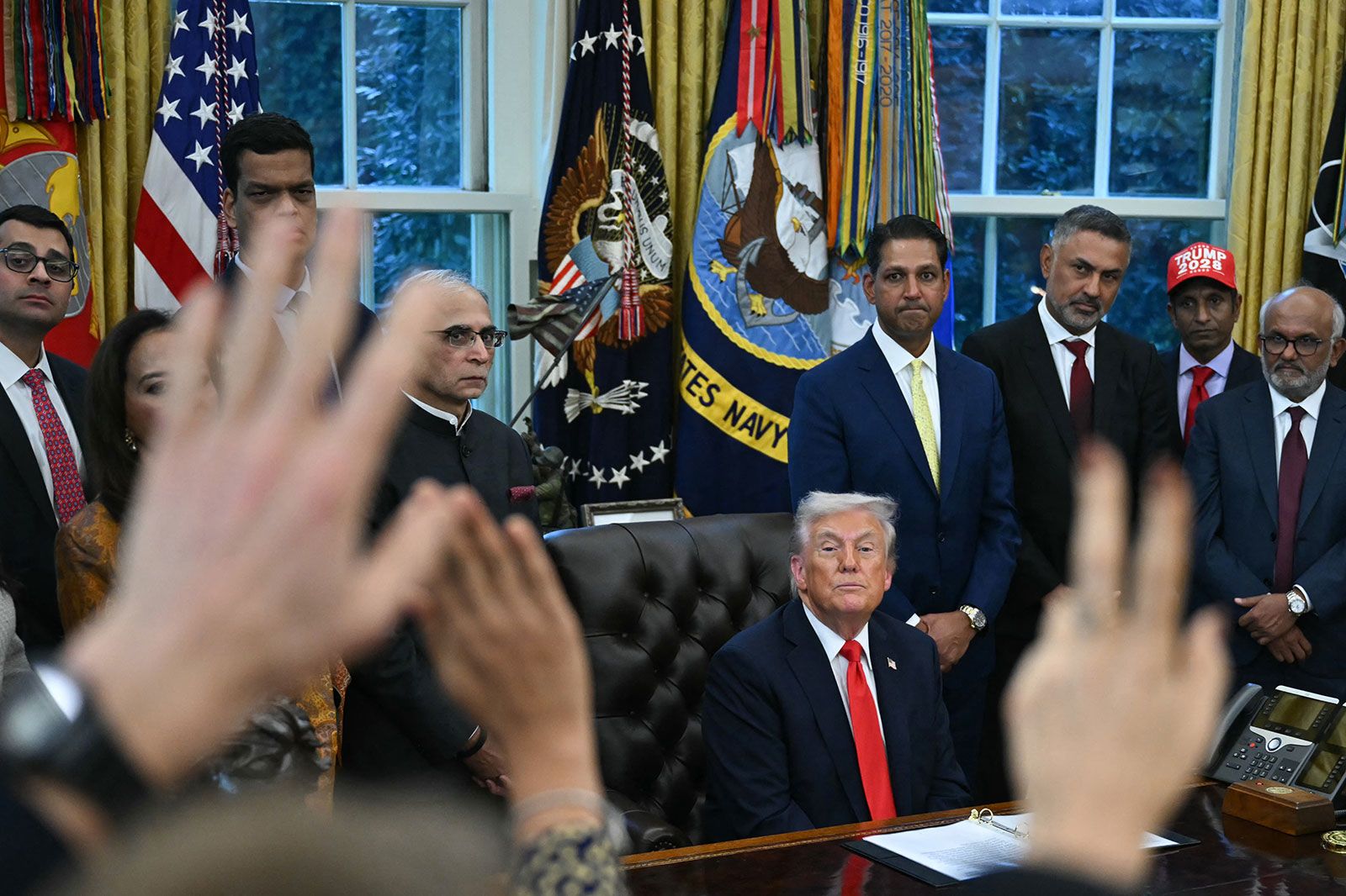 President Donald Trump takes questions from reporters in the Oval Office on October 21.