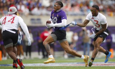 Justin Jefferson of the Minnesota Vikings has his flag pulled by Derwin James Jr. of the Los Angeles Chargers during last season's Pro Bowl in Orlando.