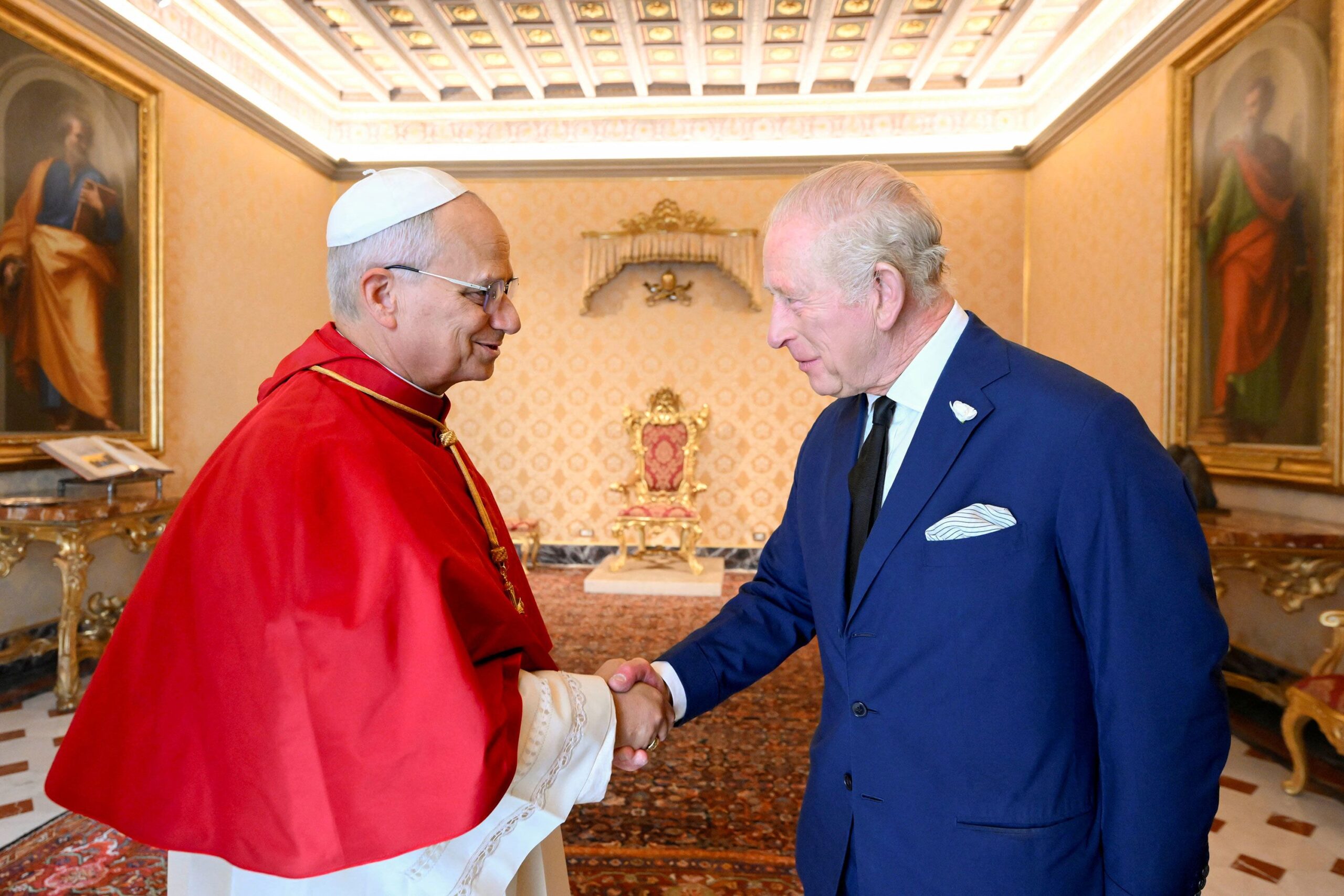 Pope Leo greets King Charles during a private audience at the Vatican October 23