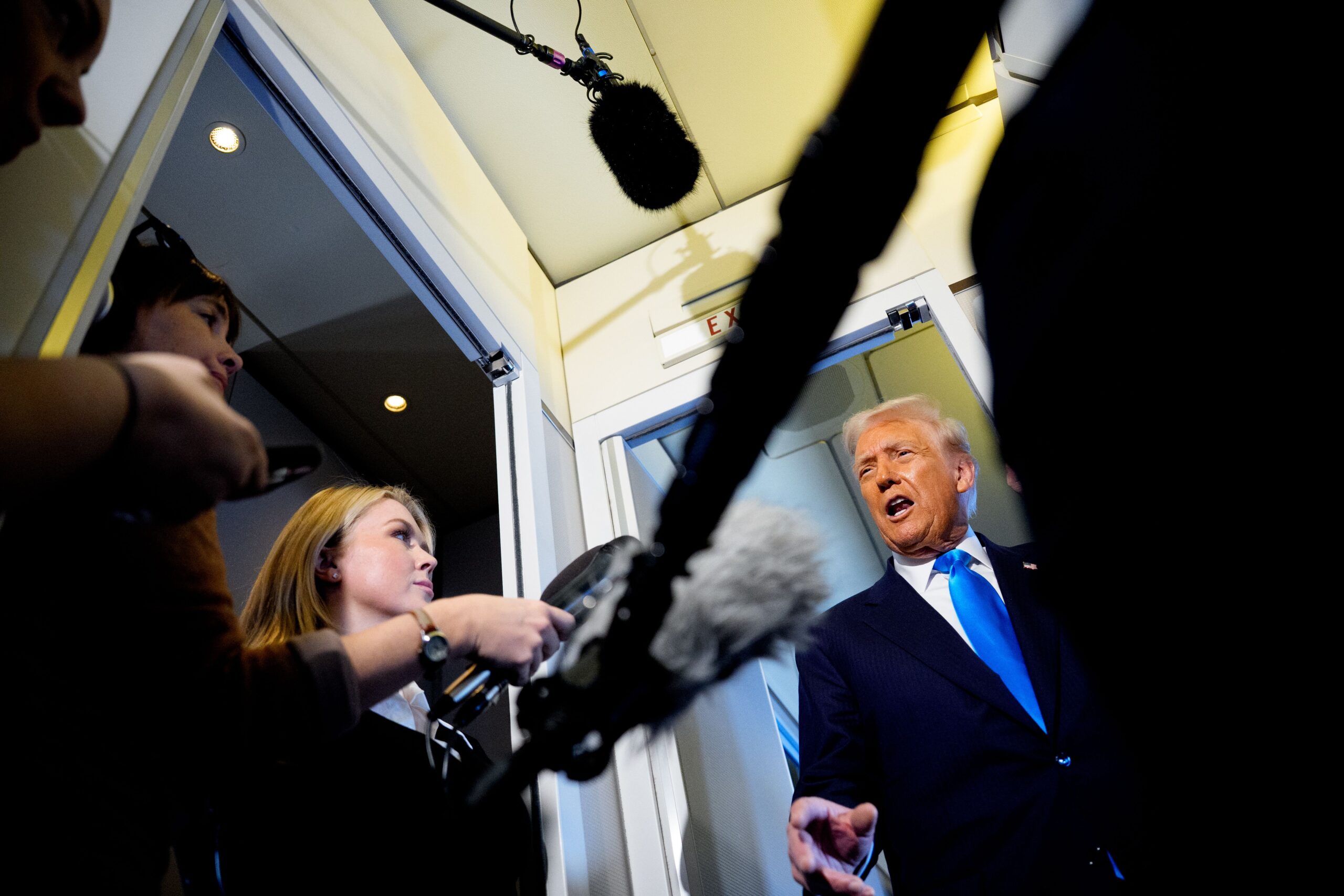 US President Donald Trump speaks to journalists aboard Air Force One en route to South Korea on October 29
