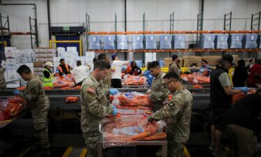 Members of the National Guard pack food at a Los Angeles Regional Food Bank facility in Los Angeles