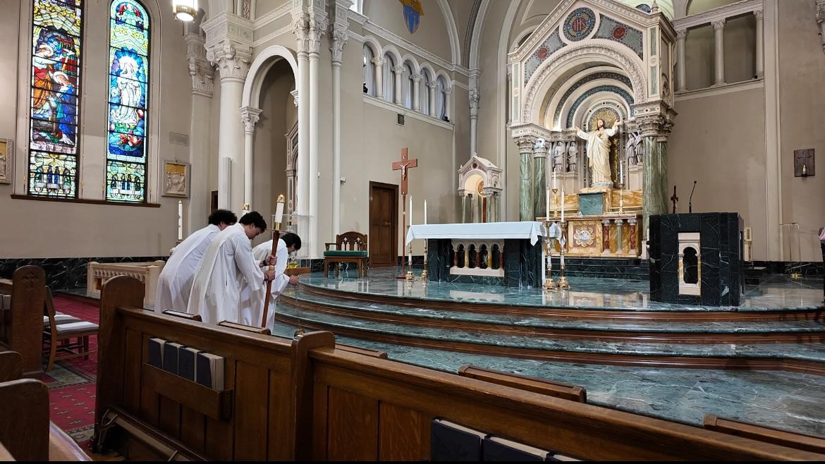 Altar servers form an entrance procession before First Auxiliary Bishop Anthony Celino leads the opening prayer at St. Patrick’s Cathedral in El Paso, Texas.