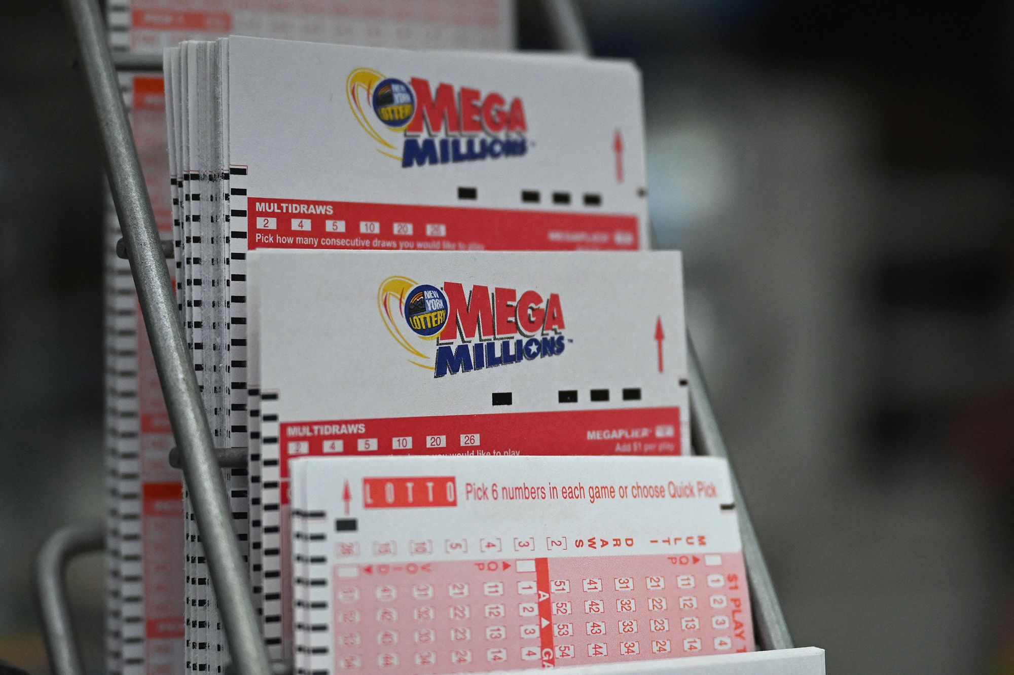 <i>Angela Weiss/AFP/Getty Images via CNN Newsource</i><br/>Lottery tickets for Mega Millions are displayed in a store in August 2023 in New York.
