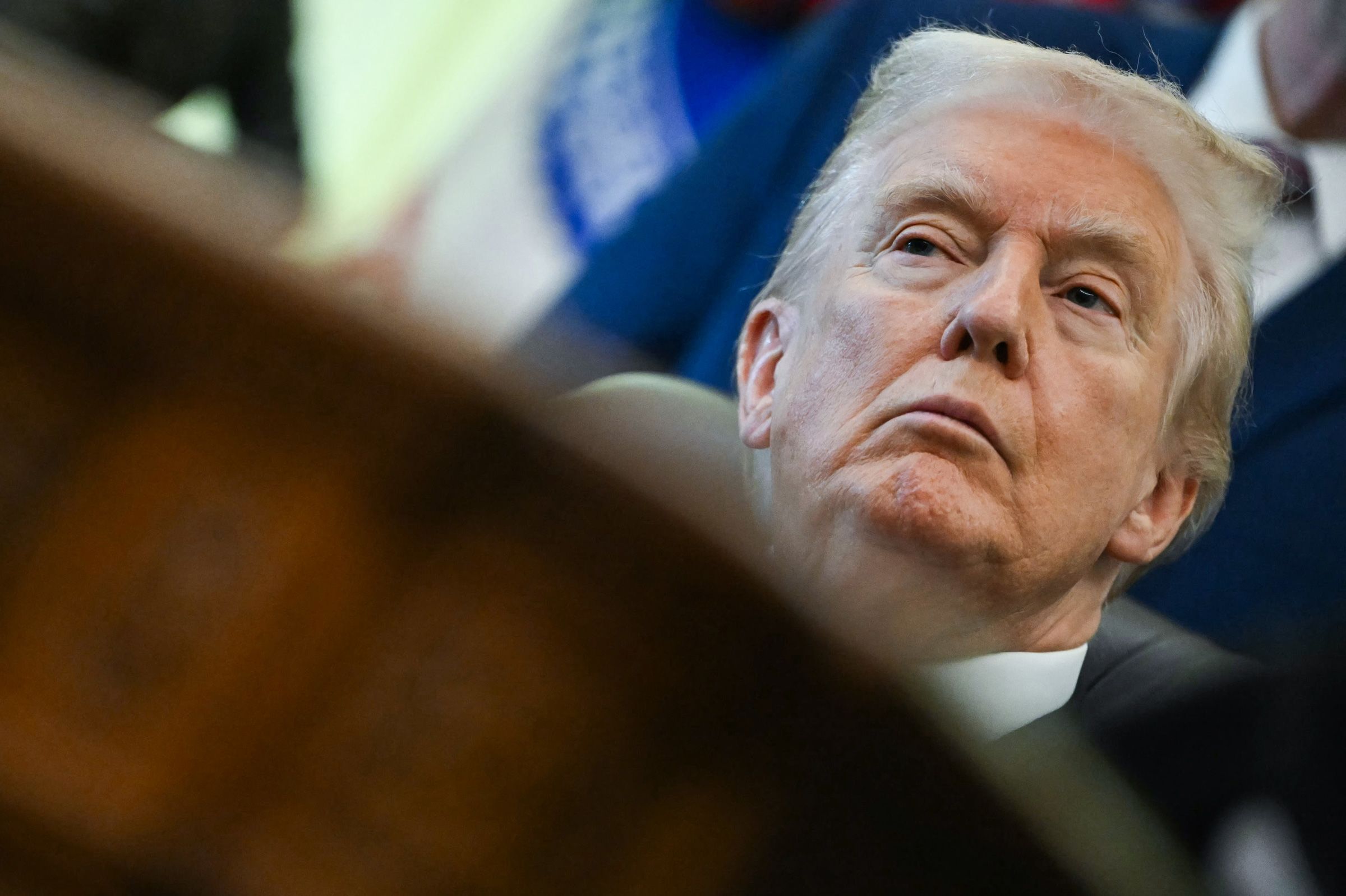 <i>Andrew Caballero-Reynolds/AFP/Getty Images via CNN Newsource</i><br/>US President Donald Trump listens during an event about weight-loss drugs in the Oval Office of the White House in Washington