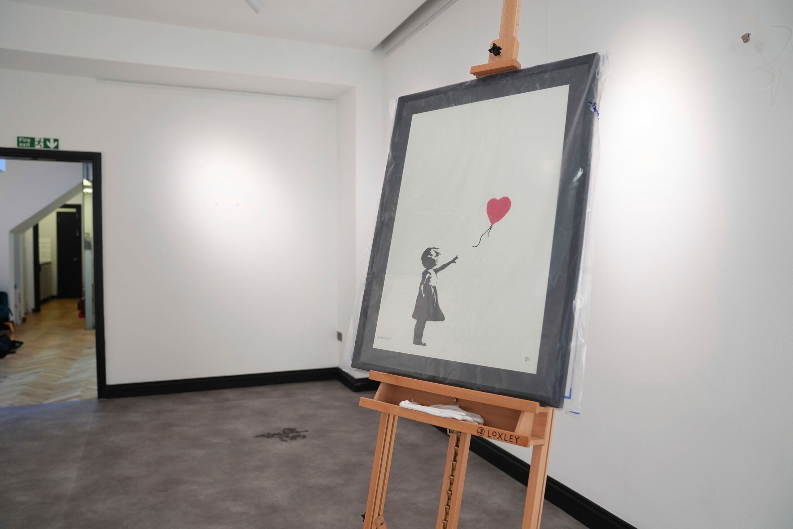 <i>James Manning/PA/AP via CNN Newsource</i><br/>A Banksy print