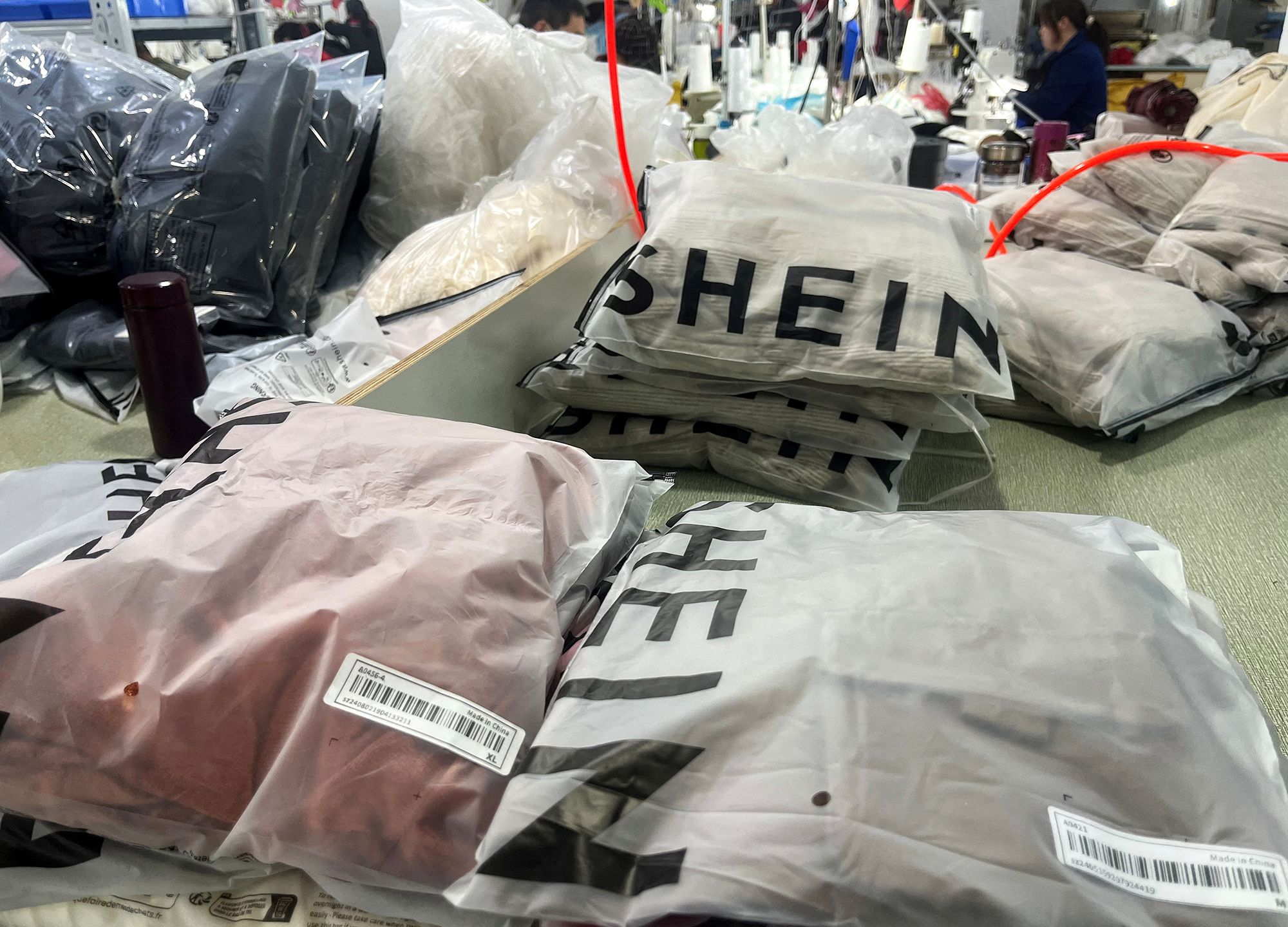 <i>Casey Hall/Reuters via CNN Newsource</i><br/>Packs of clothing at a garment factory for Shein in Guangzhou