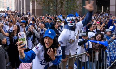 Fans cheer along the route during the Los Angeles Dodgers' World Series championship parade on Monday.