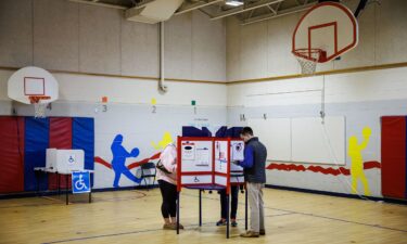 Voters cast their ballots at the Innovation Elementary School polling location in Arlington
