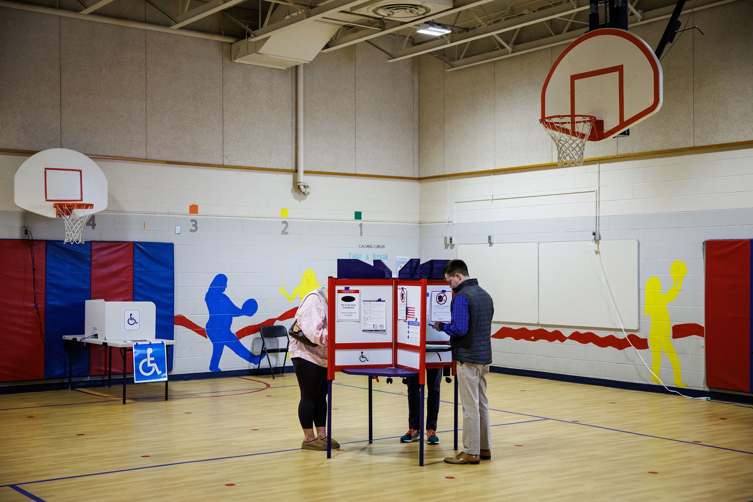 <i>Samuel Corum/Sipa USA/AP via CNN Newsource</i><br/>Voters cast their ballots at the Innovation Elementary School polling location in Arlington