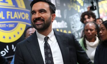 Democratic mayoral candidate Zohran Mamdani looks at the menu inside of Kreyol Flavor in the East Flatbush neighborhood of the Brooklyn