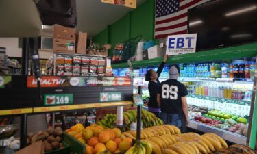 El Recuerdo Market manager Cecilia Benitez sets up a "EBT Accepted Here