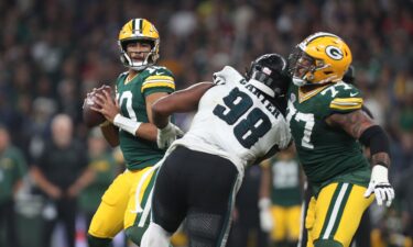 New England Patriots head coach Mike Vrabel speaks with quarterback Drake Maye during their game against Atlanta on November 2.