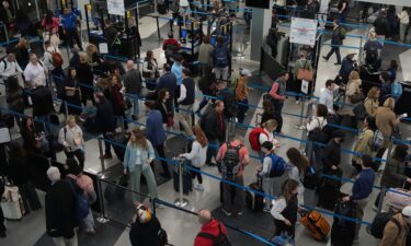 Passengers head to the rental car center at Phoenix Sky Harbor International Airport in Phoenix on Saturday.