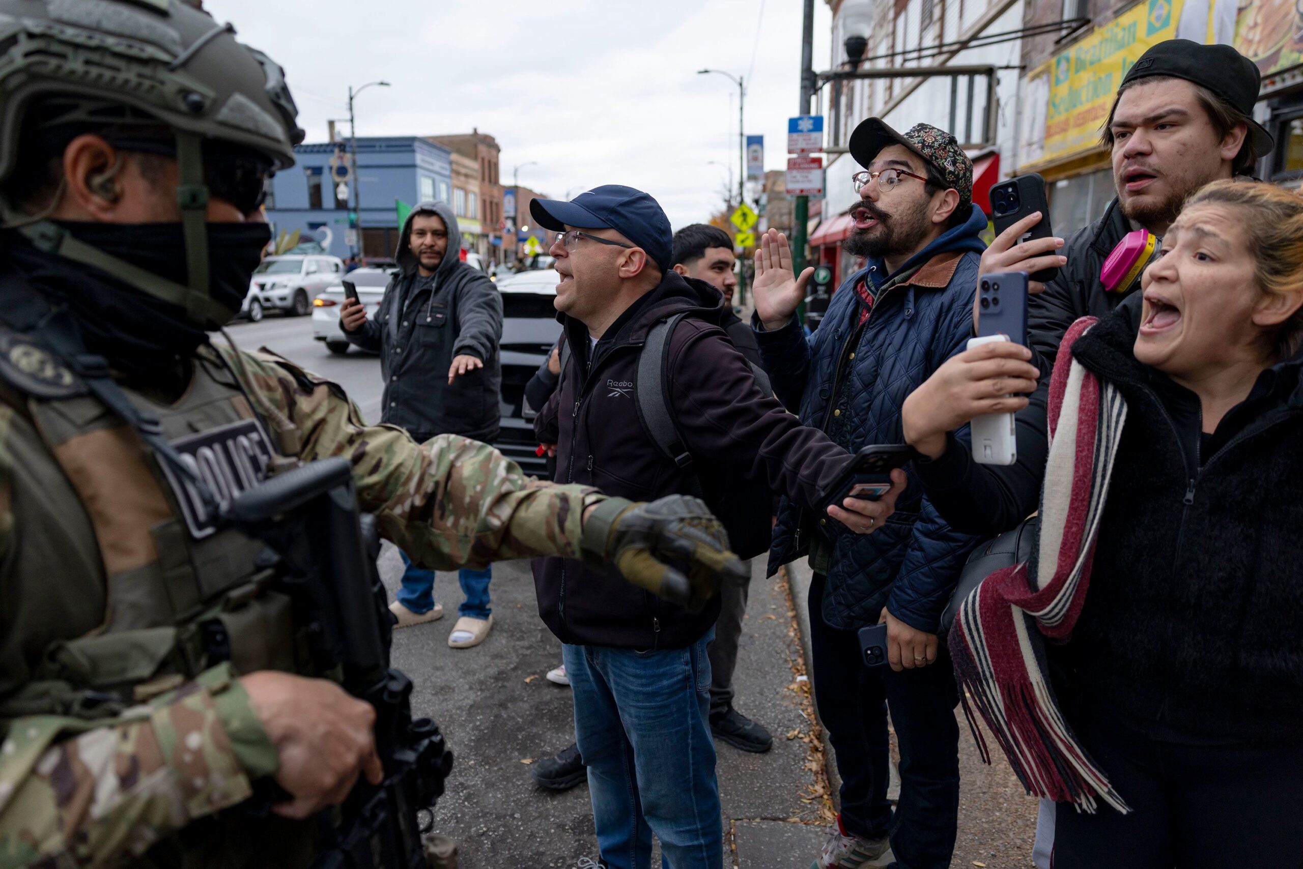 <i>Carlos Barria/Reuters via CNN Newsource</i><br/>A person carries a whistle to alert community members of the presence of federal agents after an immigration raid in Chicago's Little Village neighborhood on November 8.