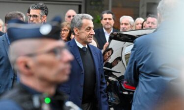 Former French President Nicolas Sarkozy leaves his home to begin serving a five-year prison sentence at La Sante prison in Paris