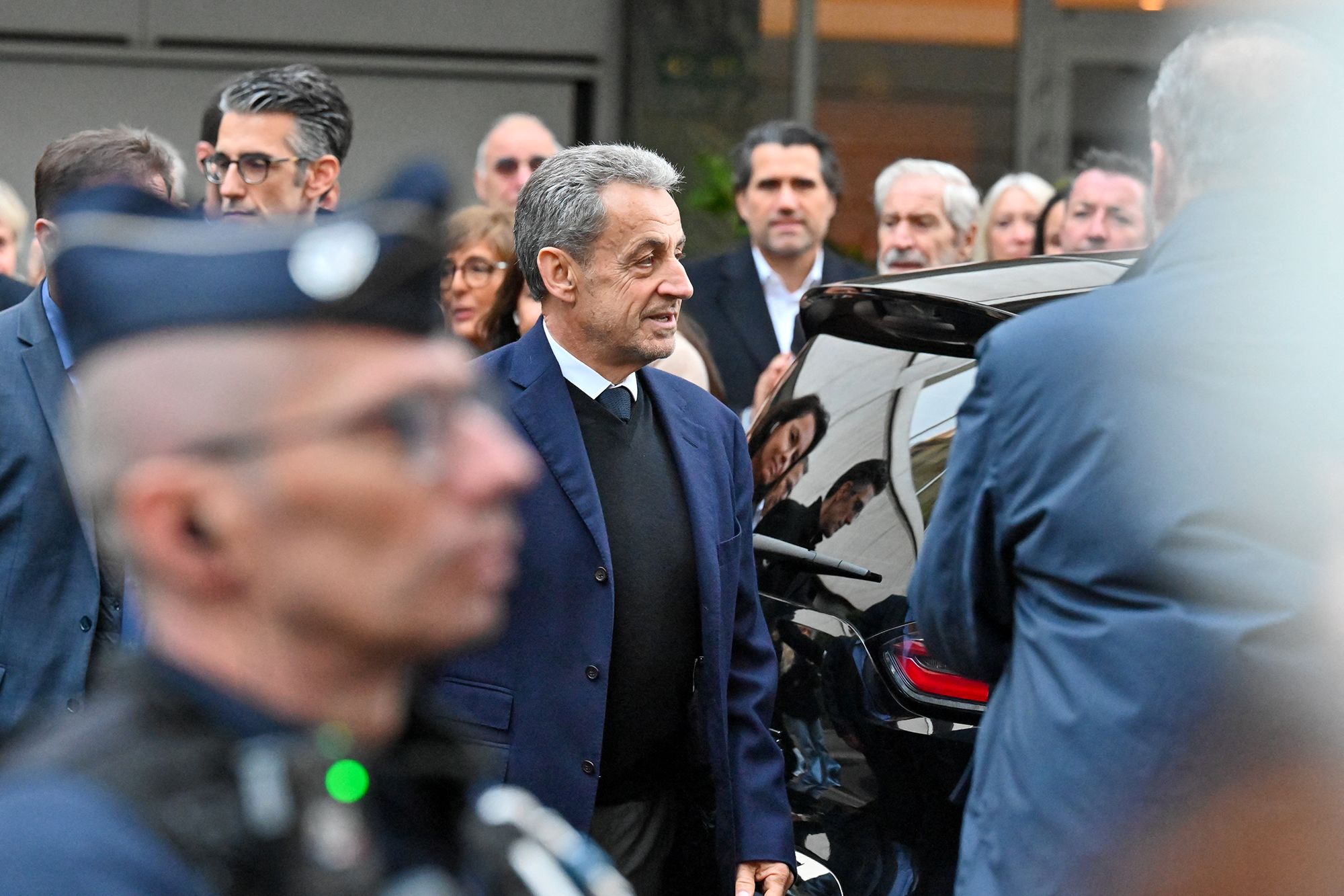 <i>Henrique Campos/Hans Lucas/AFP/Getty Images via CNN Newsource</i><br/>Former French President Nicolas Sarkozy leaves his home to begin serving a five-year prison sentence at La Sante prison in Paris