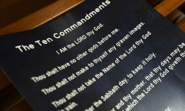 A poster displaying the Ten Commandments is seen after a Conroe ISD school board meeting in Conroe