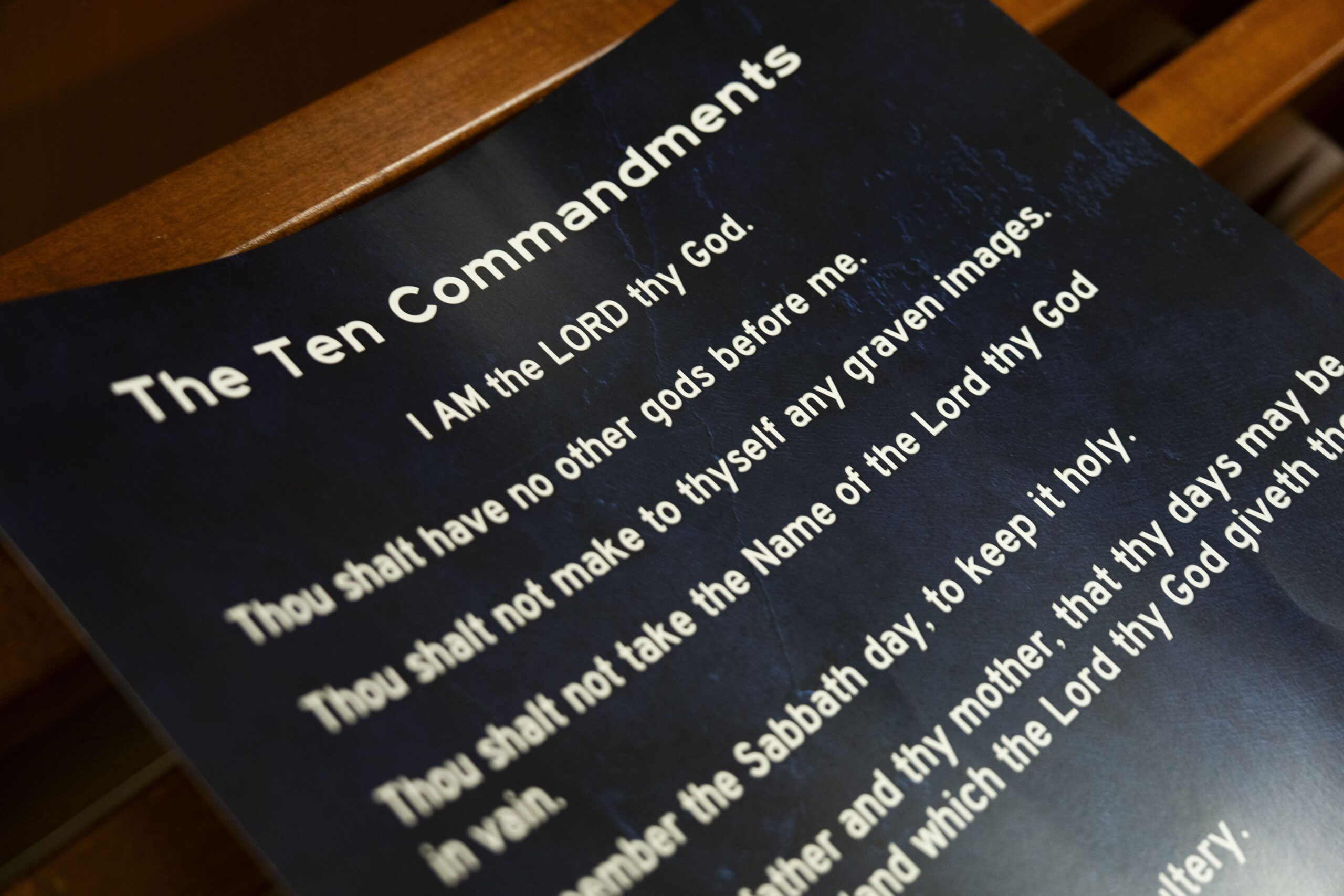 <i>Houston Chronicle/Hearst/Getty Images via CNN Newsource</i><br/>A poster displaying the Ten Commandments is seen after a Conroe ISD school board meeting in Conroe