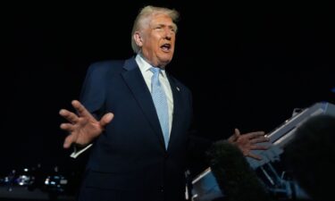 President Donald Trump speaks to reporters before boarding Air Force One at Palm Beach International Airport in West Palm Beach