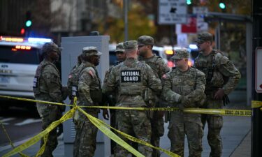 National Guard members gather after the shooting in downtown Washington