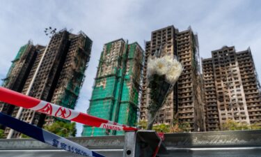 A bouquet of flowers at the scene where a major fire engulfed several residential buildings at Wang Fuk Court on November 28