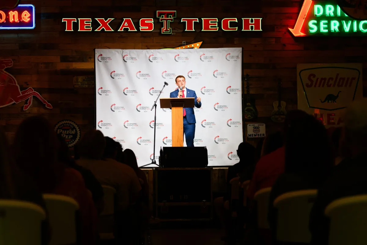 Texas Tech's TPUSA President Preston Parson speaking on stage at the Tech chapter of Turning Point USA's rally at Cook's Garage in Lubbock on Oct. 7, 2025.