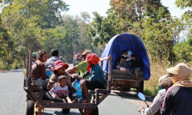 People rest at a shelter in Thailand's Buriram province following fresh clashes between Thailand and Cambodia along parts of their disputed border on Monday.