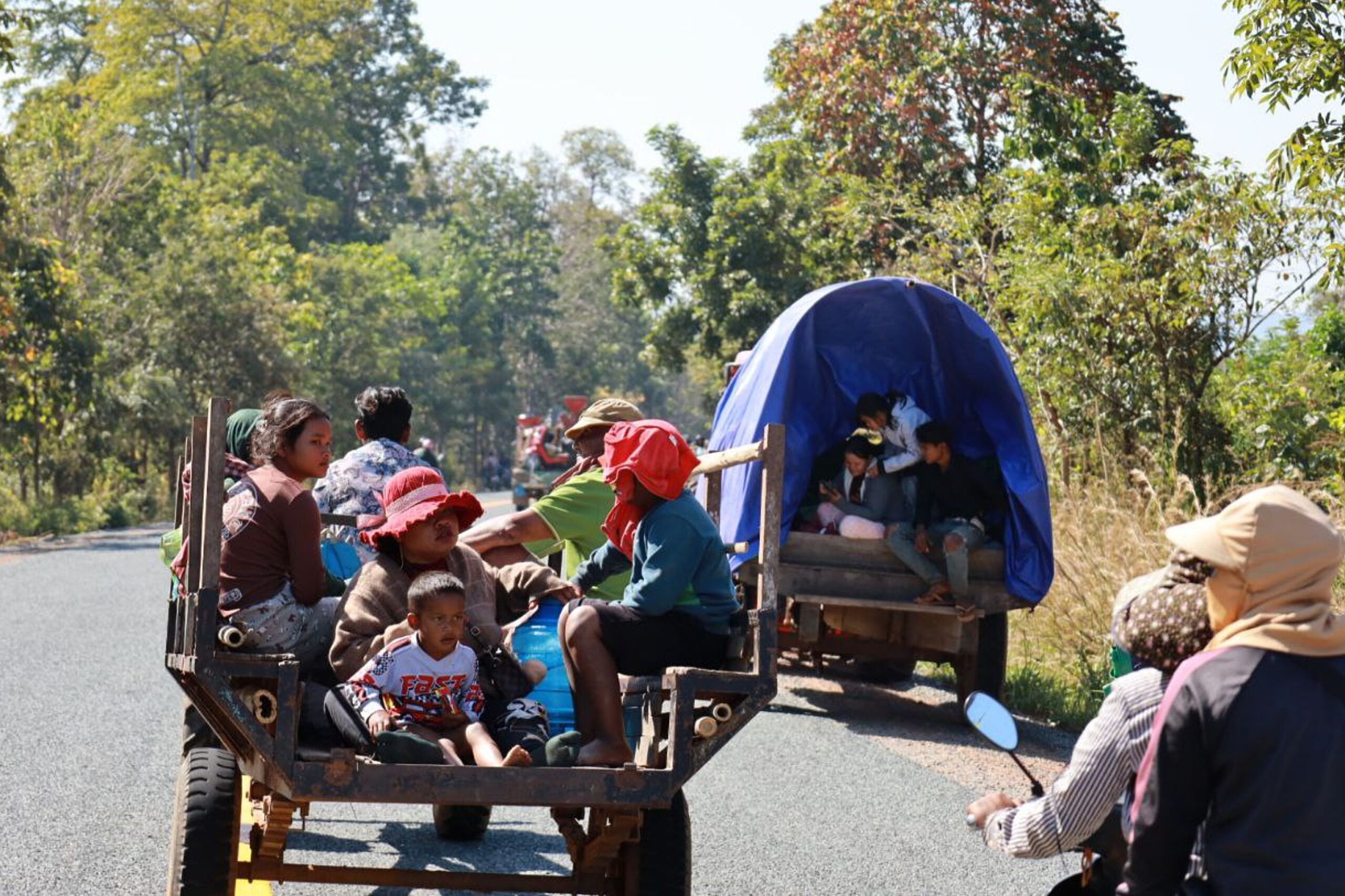 People rest at a shelter in Thailand's Buriram province following fresh clashes between Thailand and Cambodia along parts of their disputed border on Monday.