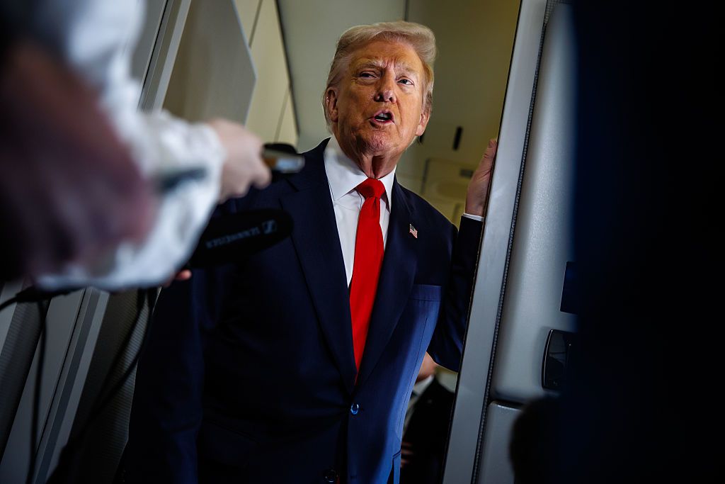 <i>Samuel Corum/Getty Images/File via CNN Newsource</i><br/>President Donald Trump speaks to reporters on Air Force One on October 31