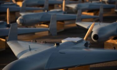 Unmanned Combat Attack System (LUCAS) drones are positioned on the tarmac at an undisclosed base in the US Central Command operating area