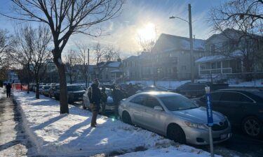A man walks through the Cedar-Riverside neighborhood