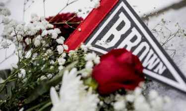 A person takes a moment in front of the Barus & Holley engineering building