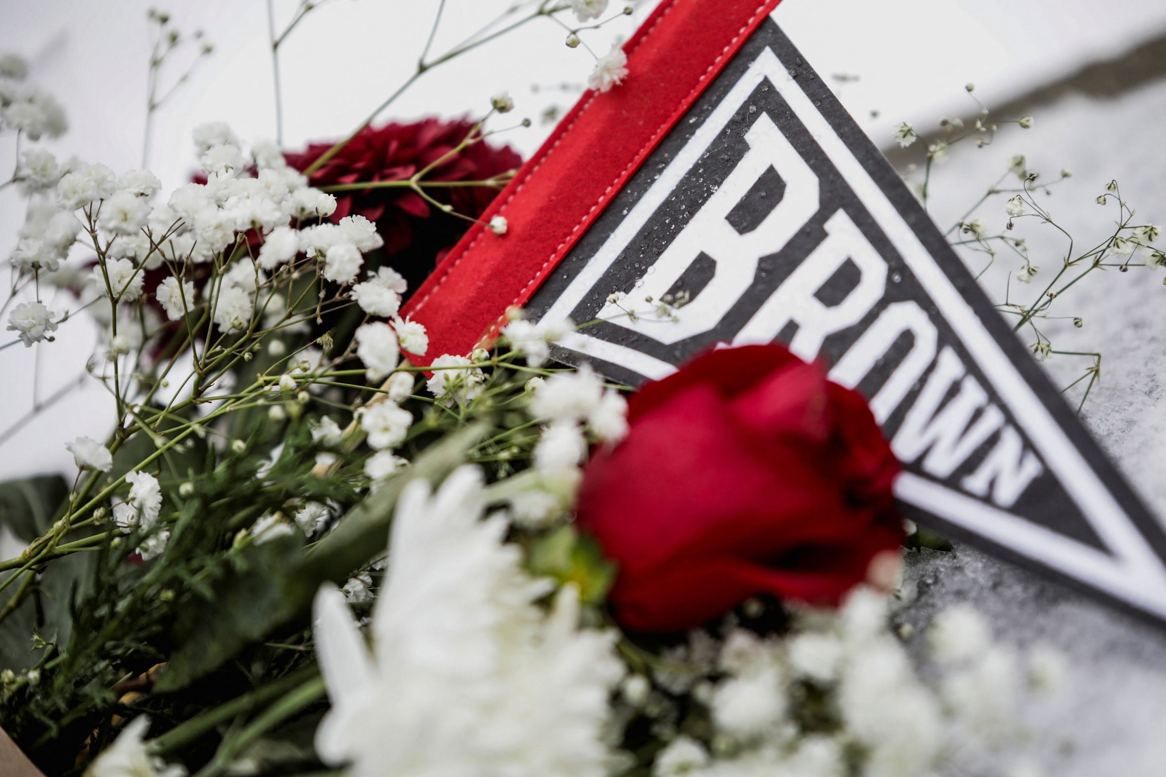 <i>Taylor Coester/Reuters via CNN Newsource</i><br/>A person takes a moment in front of the Barus & Holley engineering building