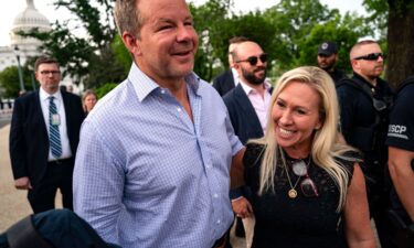 Rep. Marjorie Taylor Greene and her boyfriend Brian Glenn walk together in May 2024 in Washington