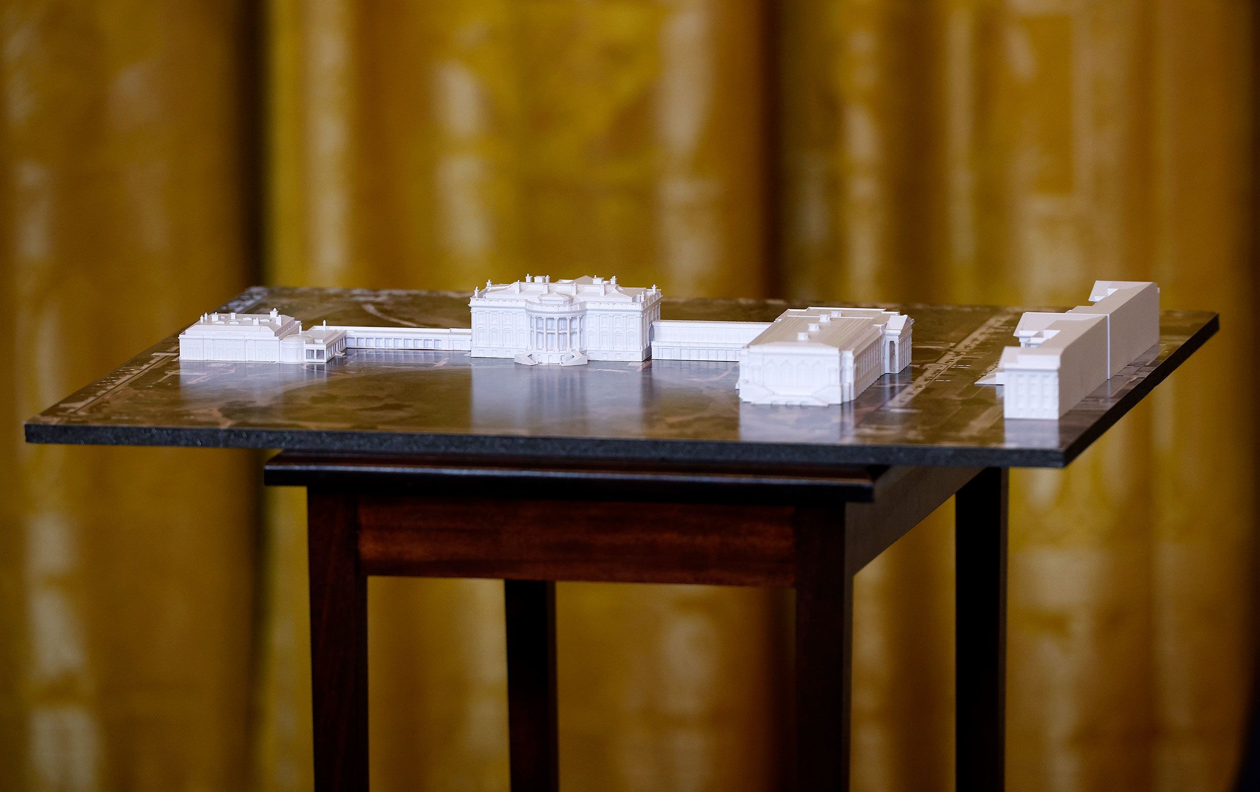 <i>Kevin Dietsch/Getty Images/File via CNN Newsource</i><br/>A model of the White House and proposed ballroom is displayed during a fundraising dinner with President Donald Trump in the East Room of the White House on October 15.