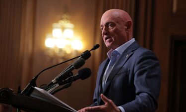 U.S. Sen. Mark Kelly speaks at a news conference in the U.S. Capitol on December 1 in Washington